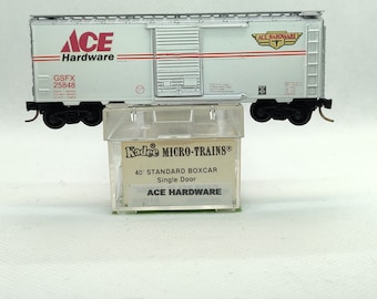 Custom painted and decaled N-scale Kadee Micro-Trains boxcar, white and silver with Ace Hardware logo