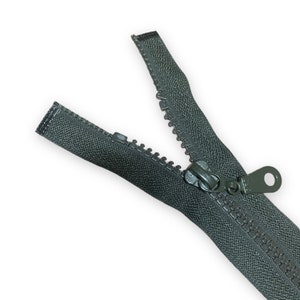 May include: A dark green zipper with a metal slider and pull tab. The zipper is open and the teeth are visible.