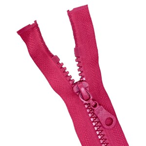 May include: A pink zipper with a plastic slider and a pull tab. The zipper is open and the teeth are visible.