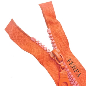 May include: Orange zipper with pink teeth and a pull tab with the text "SFS" and "FERPA".