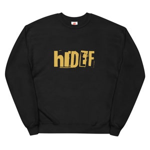 Può includere: Felpa nera con una grafica "HiDef" dorata stampata sul davanti.