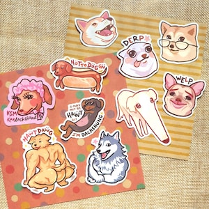 May include: A selection of dog-themed stickers with humorous designs. The stickers depict different dog breeds with amusing expressions and text, such as "DERP" and "WELP." The stickers are displayed on a textured background.