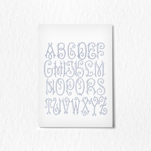 May include: A decorative alphabet with each letter in a unique, ornate, and stylized font. The letters are in a light blue color and are arranged in alphabetical order.