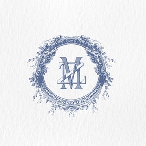 May include: A blue monogram with the letters "ML" in a decorative, ornate frame. The frame is made of a floral design with leaves and flowers.