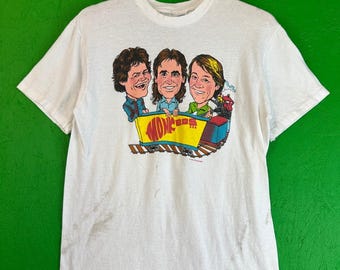 Vintage 1980s THE MONKEES Einzelstich Zug-Grafik-T-Shirt auf Hanes-Etikett L