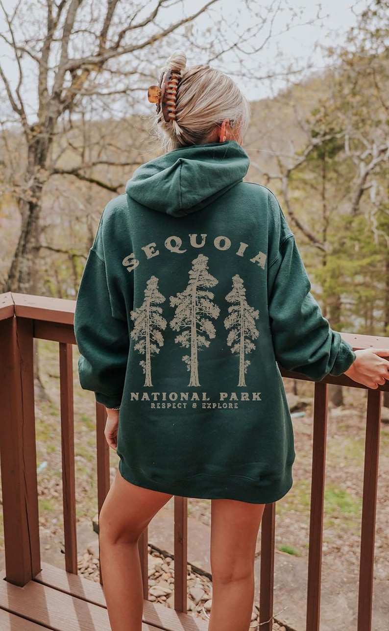 May include: A dark green hooded sweatshirt with the text "Sequoia National Park Respect & Explore" and a graphic of three trees.