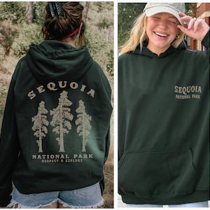 May include: A dark green hooded sweatshirt with the text "Sequoia National Park" and a graphic of three trees. The text "Respect & Explore" is below the graphic.