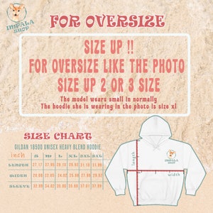 May include: Size chart for a unisex Gildan 18500 heavy blend hoodie. The chart shows measurements in inches for length, width, and sleeve length for sizes S, M, L, XL, 2XL, and 3XL. The chart is on a background with a beach scene and the text "For Oversize" and "Size Up!!" in red.