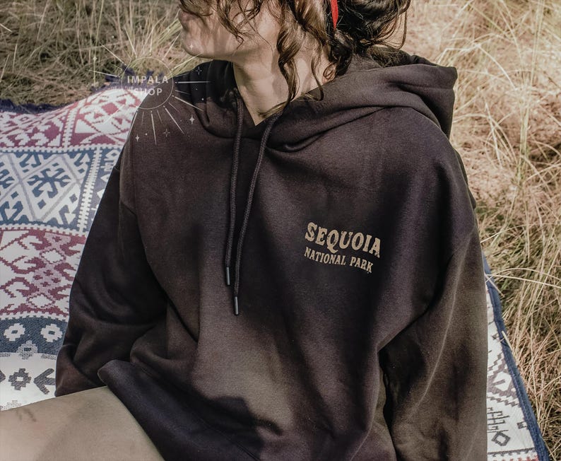May include: A black hooded sweatshirt with the text "Sequoia National Park" printed on the front.