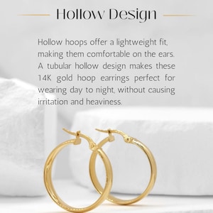 May include: A pair of 14K gold hoop earrings with a tubular hollow design. The text above the earrings reads: Hollow Design. Hollow hoops offer a lightweight fit, making them comfortable on the ears. A tubular hollow design makes these 14K gold hoop earrings perfect for wearing day to night, without causing irritation and heaviness.