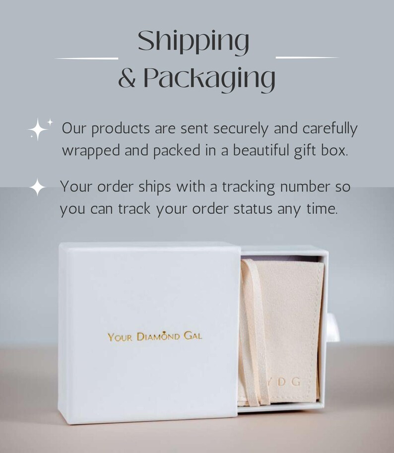 May include: A white gift box with the text "Your Diamond Gal" in gold lettering. The box is partially open, revealing a beige pouch inside. The words "Shipping & Packaging" are at the top of the image.