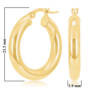 These 14k yellow gold round thick hoop earrings feature a rich, high polish shine, bringing out the tubular shape and smooth round finish. Click-top posts secure these trendy handcrafted yellow gold hoops, made for pierced ears. Lightweight hoops.