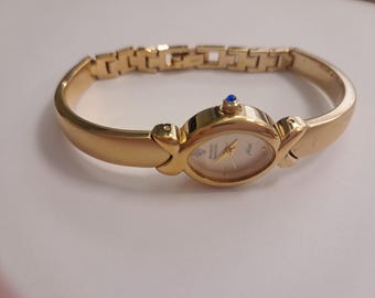 Armitron Diamond Now Watch       Gold Tone Blue Crystal