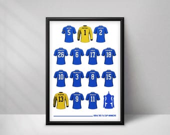 May include: A framed print featuring a grid of blue and yellow soccer jerseys with player names and numbers, including a trophy illustration and the text 1994/95 FA CUP WINNERS at the bottom, displayed in a simple black frame on a white background.