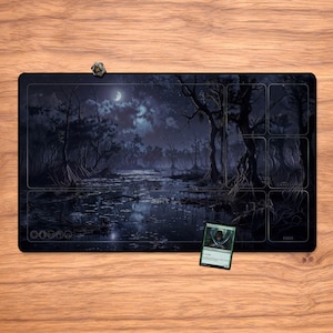 May include: A black playmat featuring a dark swamp scene with a full moon, trees, and water. A small, multi-sided die and a trading card are on the mat. The mat has designated areas for gameplay.