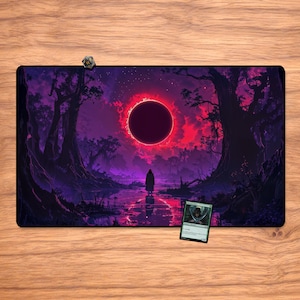 May include: A rectangular playmat featuring a fantasy landscape with a dark forest, a figure, and a celestial eclipse. The color palette includes shades of purple, red, and black. A die and a card are on the mat.