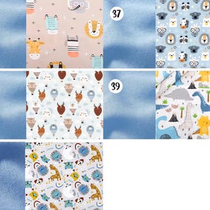 May include: A collection of five fabric swatches labeled 36 through 40. Pattern 36 features pastel animals on pink. Pattern 37 shows animal faces on light blue. Pattern 38 displays hot air balloons on white. Pattern 39 depicts dinosaurs on white. Pattern 40 shows colorful animals on gray.