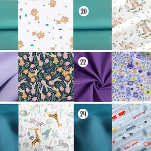 May include: A collection of fabric swatches labeled 19 through 24, featuring solid teal, lavender, and purple colors alongside patterned prints of cartoon deer, woodland animals in wreaths, rabbits with flowers, giraffes, and various city vehicles.
