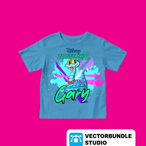 May include: A light blue t-shirt with a cartoon snake character named Gary from Disney's Zootopia 2. The design includes the text "Disney Zootopia 2" and "Gary" in a playful font, with colourful accents.