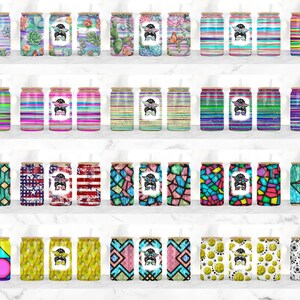 May include: A set of 30 colorful, patterned, stainless steel tumblers with a straw. The tumblers feature various designs, including geometric patterns, floral prints, and abstract art.