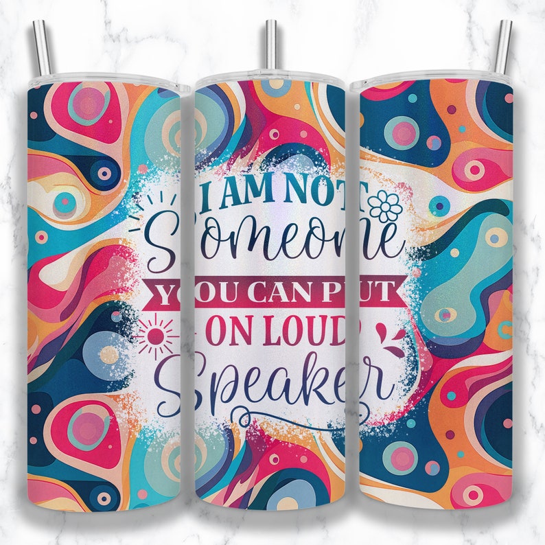 May include: A colorful tumbler with a white background and the text "I am not someone you can put on loud speaker". The tumbler has a swirling pattern of blue, pink, orange, and yellow.