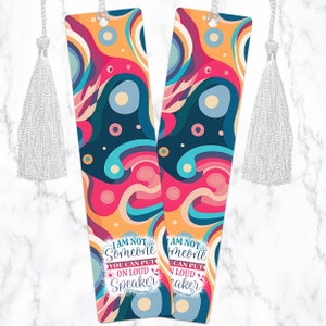 May include: Two colorful bookmarks with a white tassel. The bookmarks feature a colorful abstract design with the text "I am not someone you can put on loud speaker" and "I am not someone you can put on loud speaker".