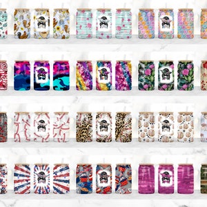 May include: A collection of 20 different patterned stainless steel tumblers with a straw. Each tumbler features a unique design with a variety of colors and patterns, including floral, geometric, and abstract designs.