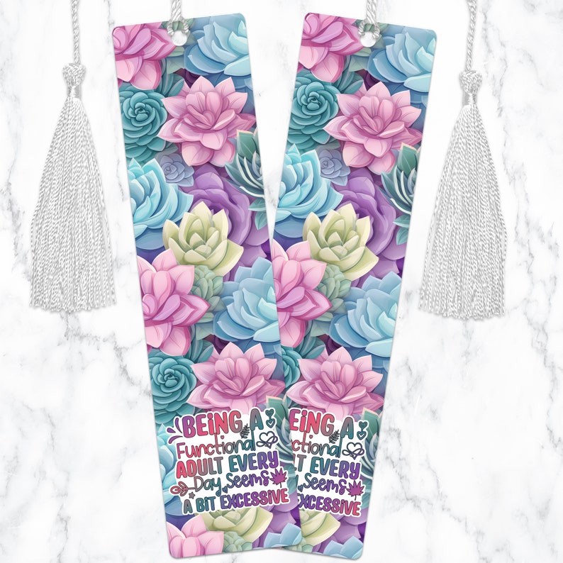 May include: Two colorful bookmarks with a succulent floral pattern. The text on the bookmarks reads "Being a Functional Adult Every Day Seems a Bit Excessive".
