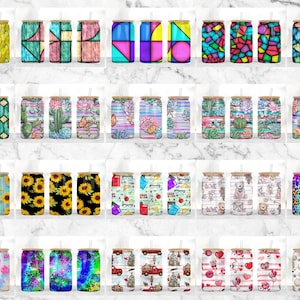 May include: Twenty different designs for sublimation tumblers. The designs include stained glass, cacti, sunflowers, school supplies, tie dye, and more. The tumblers are all white with a black lid and a straw.