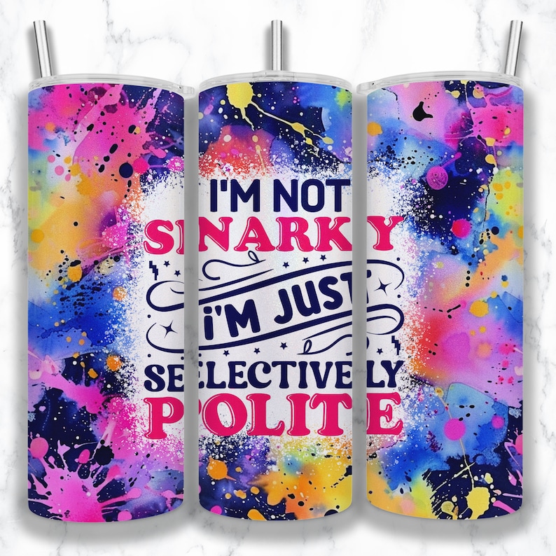 May include: A colorful tumbler with a white background and the text "I'm not snarky I'm just selectively polite". The tumbler has a blue, pink, yellow, and green watercolor design.