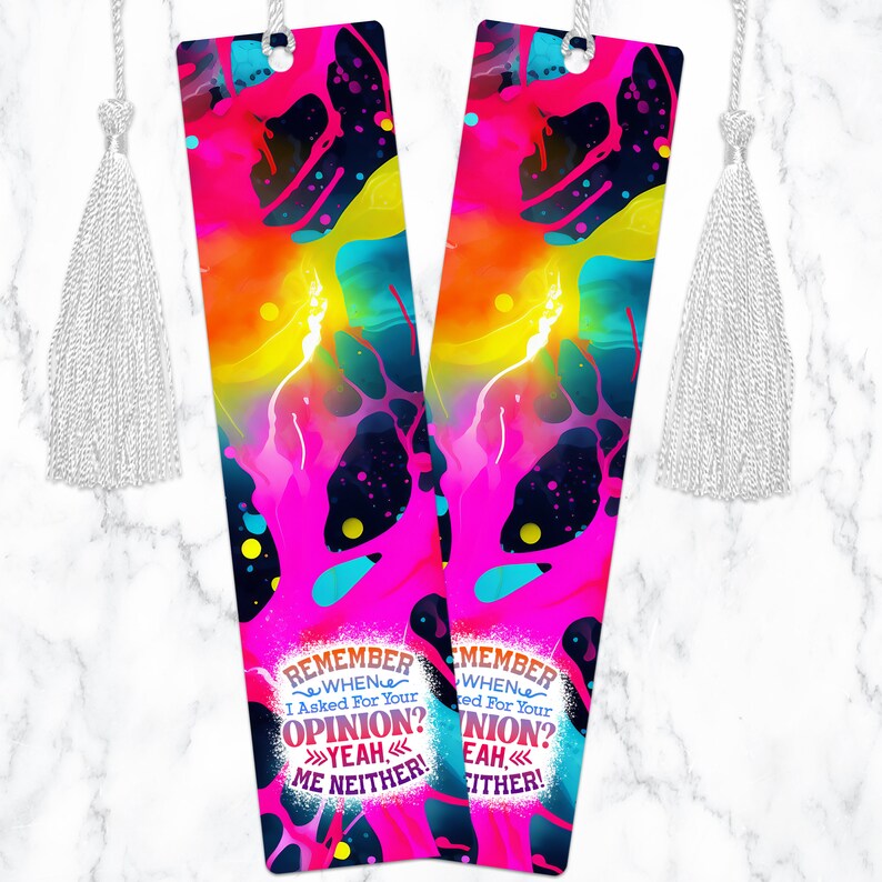 May include: Two colorful bookmarks with a pink, yellow, blue, and black abstract design. The bookmarks have a white tassel and text that reads "REMEMBER WHEN I ASKED FOR YOUR OPINION? YEAH ME NEITHER!" and "MEMBER WHEN I ASKED FOR YOUR OPINION? YEAH EITHER!"
