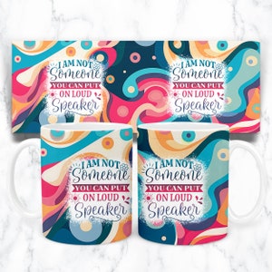 May include: Two white mugs with a colorful abstract design. The mugs feature the text "I am not someone you can put on loud speaker".