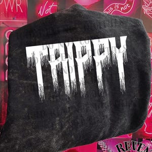 May include: Black t-shirt with white dripping text that says "Trippy".
