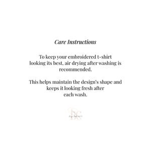 May include: A white informational graphic with black text that reads: Care Instructions. To keep your embroidered t-shirt looking its best, air drying after washing is recommended. This helps maintain the design's shape and keeps it looking fresh after each wash. A small logo is at the bottom.