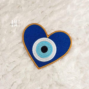 Evil Eye Patch: Embroidered Heart Protection Symbol for jackets, totes, DIY projects
