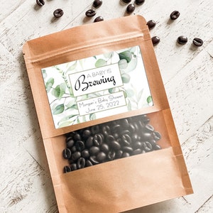 A baby is brewing coffee bean bags for baby shower party favors 5.5”x7.9” (Comes with or without Coffee Beans)