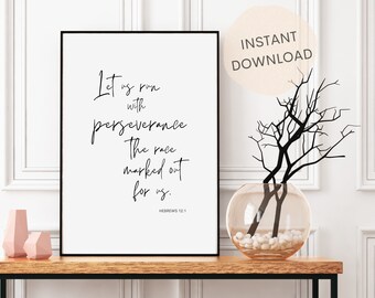 May include: Black and white printable wall art with a quote from Hebrews 12:1, "Let us run with perseverance. The race marked out for us." The quote is written in a modern calligraphy style. The art is framed in a black frame and is displayed on a wooden table with a vase of branches.
