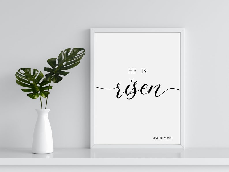 A picture frame of black text on a white background.  The bible verse "He is Risen." from Matthew 28:6.