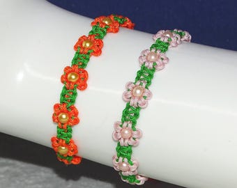 Macrame bracelet with floral pattern / orange, pink / sliding clasp