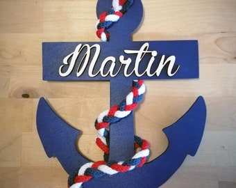 Wooden name on a marine anchor