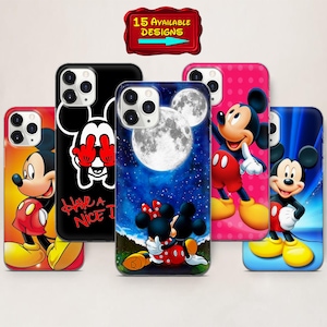 May include: A selection of phone cases with Mickey Mouse designs. The cases showcase different images, such as Mickey and Minnie Mouse under a full moon, and Mickey Mouse in various poses. The cases are in a range of colours, including black, pink, and blue.