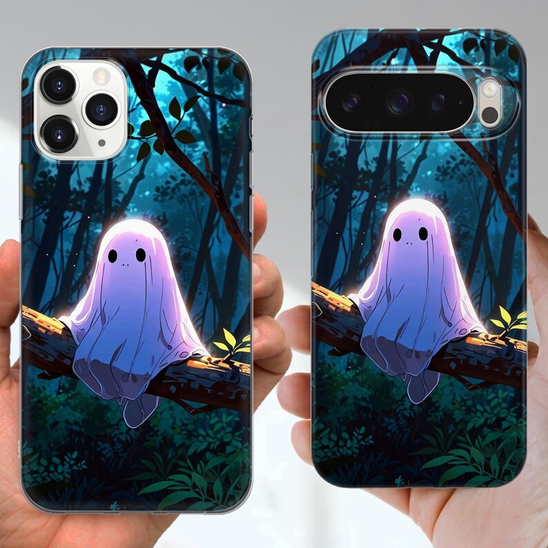 May include: Phone cases with a cartoon ghost design. The ghost is draped in a light purple sheet and sits on a tree branch. The background shows a dark forest with blue and green hues.