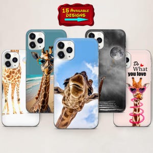 May include: A selection of phone cases with giraffe-themed designs. The cases showcase giraffe illustrations, some wearing sunglasses, set against beach, sky, and motivational quote backgrounds. A sign at the top reads "15 AVAILABLE DESIGNS".