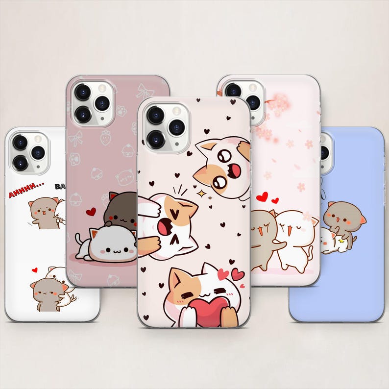 May include: Collection of phone cases with cute cartoon cat illustrations. The cases feature various designs, including cats hugging, holding hearts, and with text. The cases are in white, pink, and blue, with black and red accents.