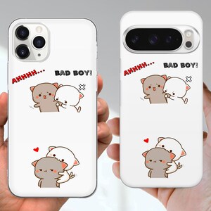 May include: White phone cases with a cartoon cat design. One case has the text "AHHHH... BAD BOY!" in red and black. The other case has the same text and a different cat illustration. Both cases have a heart graphic.