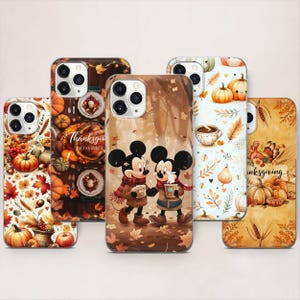 May include: A collection of phone cases with fall-themed designs. The cases feature pumpkins, autumn leaves, and Mickey and Minnie Mouse characters. Some cases have the text "Thanksgiving November". The color palette includes orange, brown, and cream.