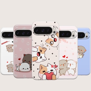 May include: A collection of five phone cases with cartoon cat designs. Each case features a different color and pattern, including hearts, flowers, and the text "AHHHH...". The cases have a clear camera cutout.