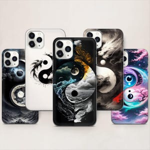 May include: A selection of phone cases with Yin and Yang artwork. The designs showcase diverse artistic styles, such as celestial bodies, dragons, and natural landscapes. The colour scheme includes black, white, blue, and pink.
