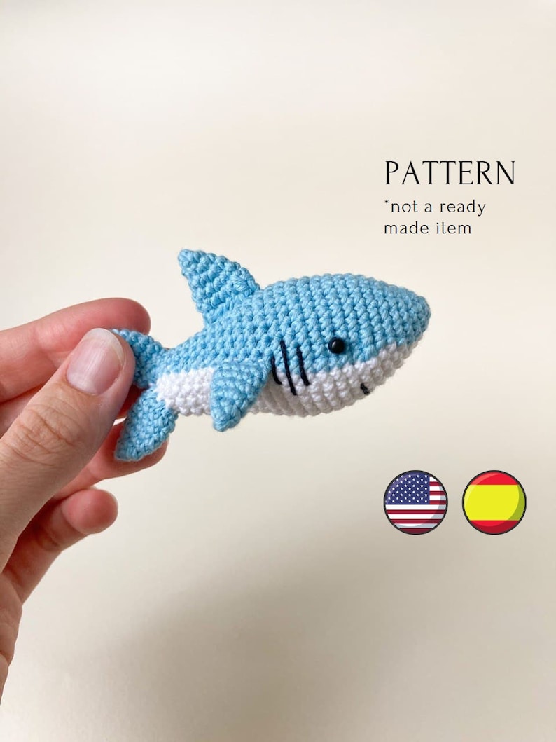 May include: Crochet pattern for a blue and white shark amigurumi. The pattern is available in English and Spanish. "PATTERN *not a ready made item*"