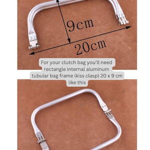 May include: Silver metal frame for a clutch bag, measuring 20 inches by 9 inches. The frame is rectangular with a kiss clasp closure.